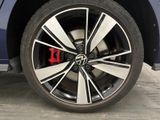 a close up of a wheel on a blue car