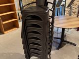 a stack of chairs and a table in a room