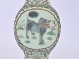 a vase that has a picture of a dog on it