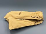 a pair of yellow bags sitting on top of a table