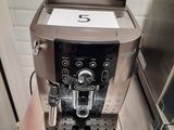 a coffee machine sitting on a counter in a kitchen