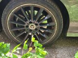 a close up of a car tire on the road