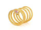 a close up of a gold ring with a pink stone