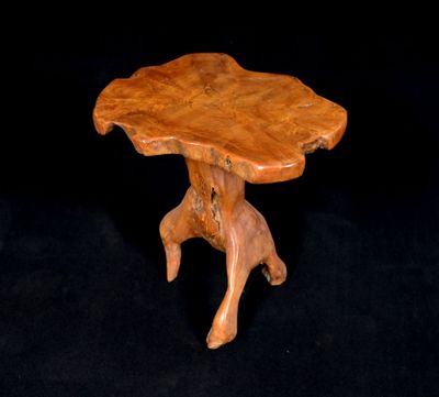 a close up of a wooden table on a black background