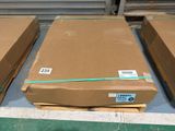 several boxes of cardboard are stacked on a pallet in a warehouse