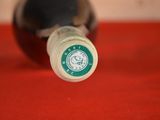 a close up of a bottle of wine on a table