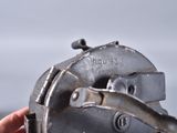 a person holding a metal object in their hand