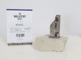 a statue of a man on a rock next to a hotel ticket
