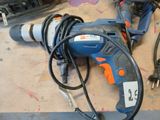 a corded drill and a corded cord on a table