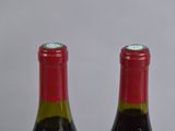 three bottles of wine sitting next to each other on a table