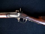 a close up of a rifle on a black background