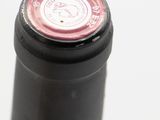 a close up of a bottle of wine on a table