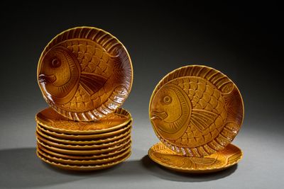 a stack of plates with a fish design on them