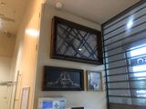 a computer sitting on a desk in front of a window