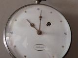 a clock that is hanging on the wall in the room