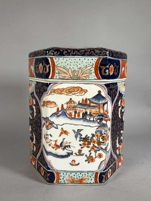 an image of a decorative container with a painting on it