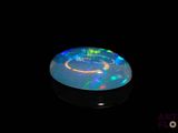 an image of a black background with a white and blue light in the center