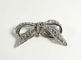 bow brooch with crystal stones on a white background