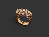 a close up of a gold ring with three diamonds on a black background