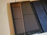 two phones sitting on top of a box on a table
