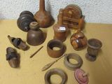 many different types of pottery sitting on a table