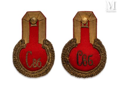 two red and gold badges with the number 35 on them
