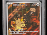 the pokemon card has a picture of a cat on it ' s back