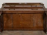 an old wooden chest sitting on top of a wooden floor