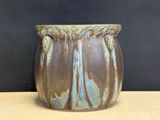 a close up of a vase on a table