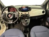 the interior of a small car with a steering wheel and dashboard