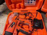 an orange tool case with tools in it sitting on the ground