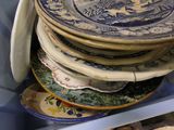 many plates stacked on top of each other in a refrigerator