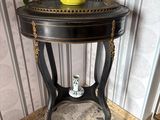 a small table with a potted plant on top of it