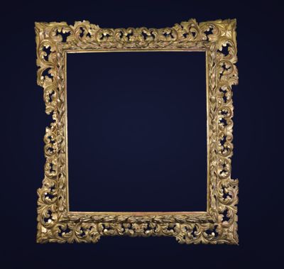 an ornate gold frame with a black background