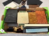 a box full of different types of tile on the floor