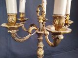 three candles that are sitting on a candle holder