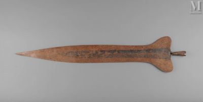 a close up of a wooden knife on a white surface