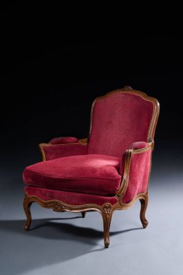 une image représentant une chaise rouge posée sur un sol gris
