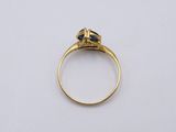 an image of a gold ring with a diamond on it