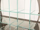 a glass display case with several shelves on it