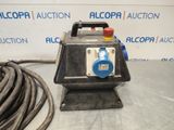 a close up of a machine on a table with a hose