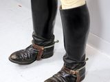 a close up of a pair of riding boots on a person ' s feet