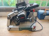 a machine that is sitting on the floor in front of a window