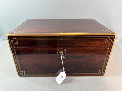 an old wooden box with a tag hanging from it ' s side
