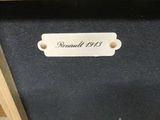 a picture of a black suitcase with a name tag on it