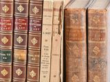 a lot of books that are sitting on a shelf