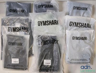 six bags of gymshark items are sitting on a counter