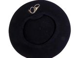 a black hat with a gold logo on it