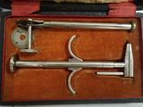 two tools in a case that are sitting on a table