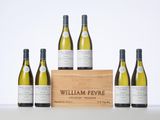 six bottles of white wine in a wooden crate with a white background
